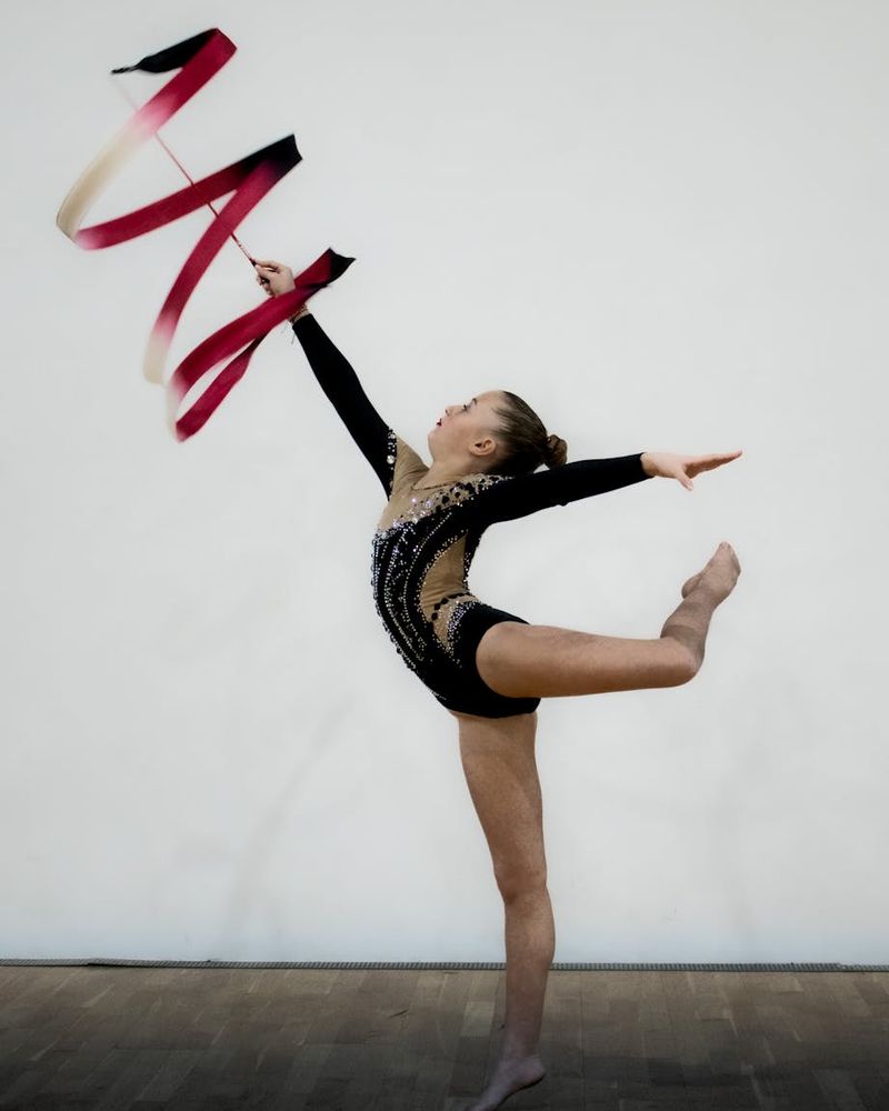 Man performing rhythmic movement in a minimal studio.